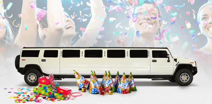 A white hummer limousine with confetti in background and birthday decoration