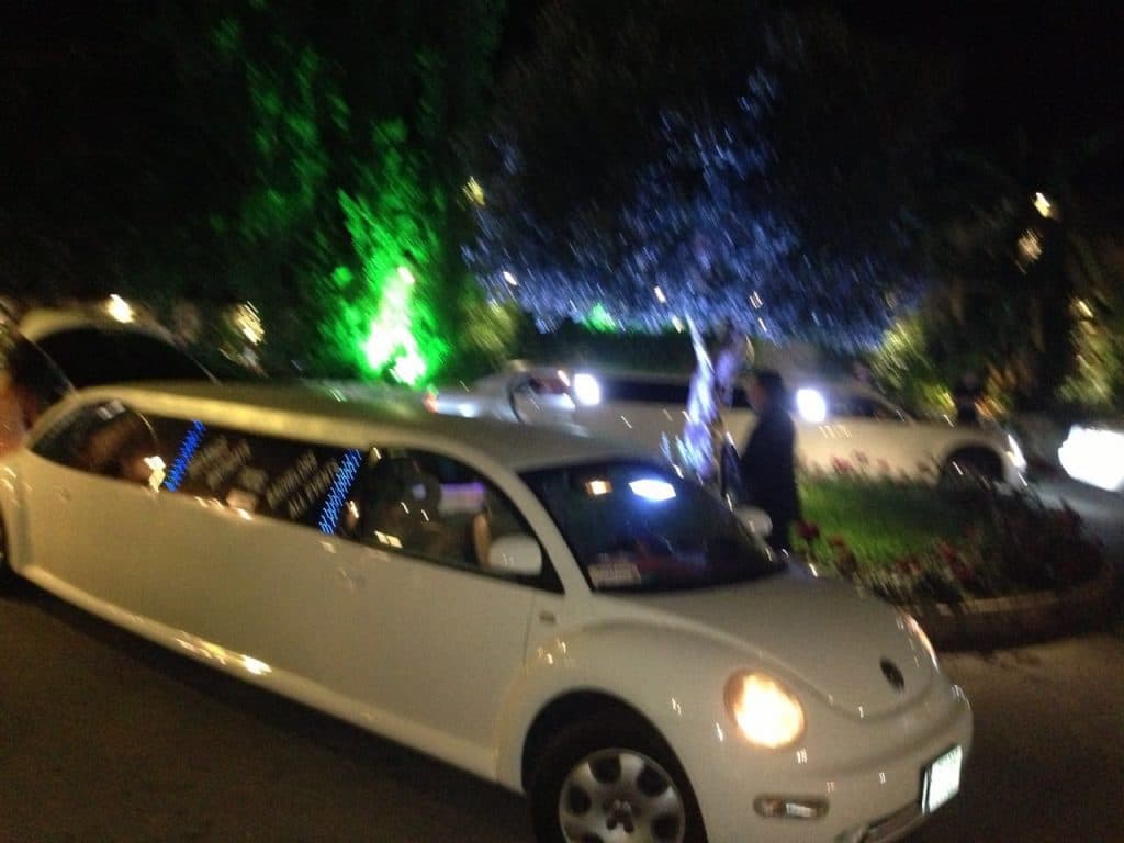 White beetle limousine from the side
