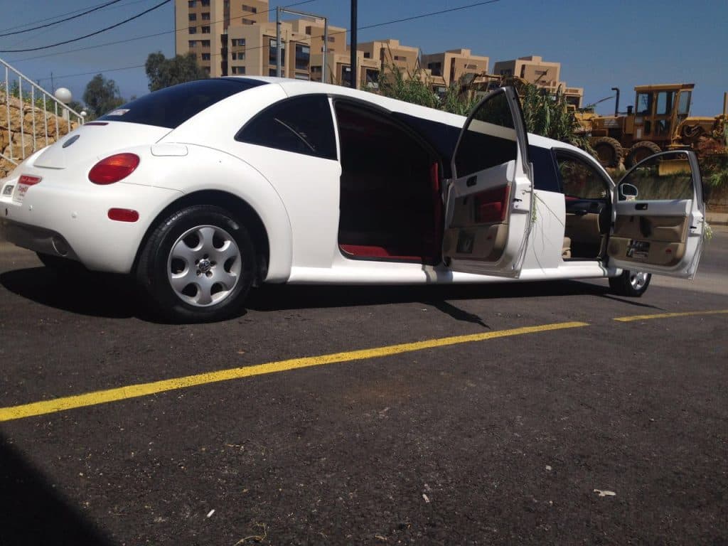 White beetle limousine with doors opened