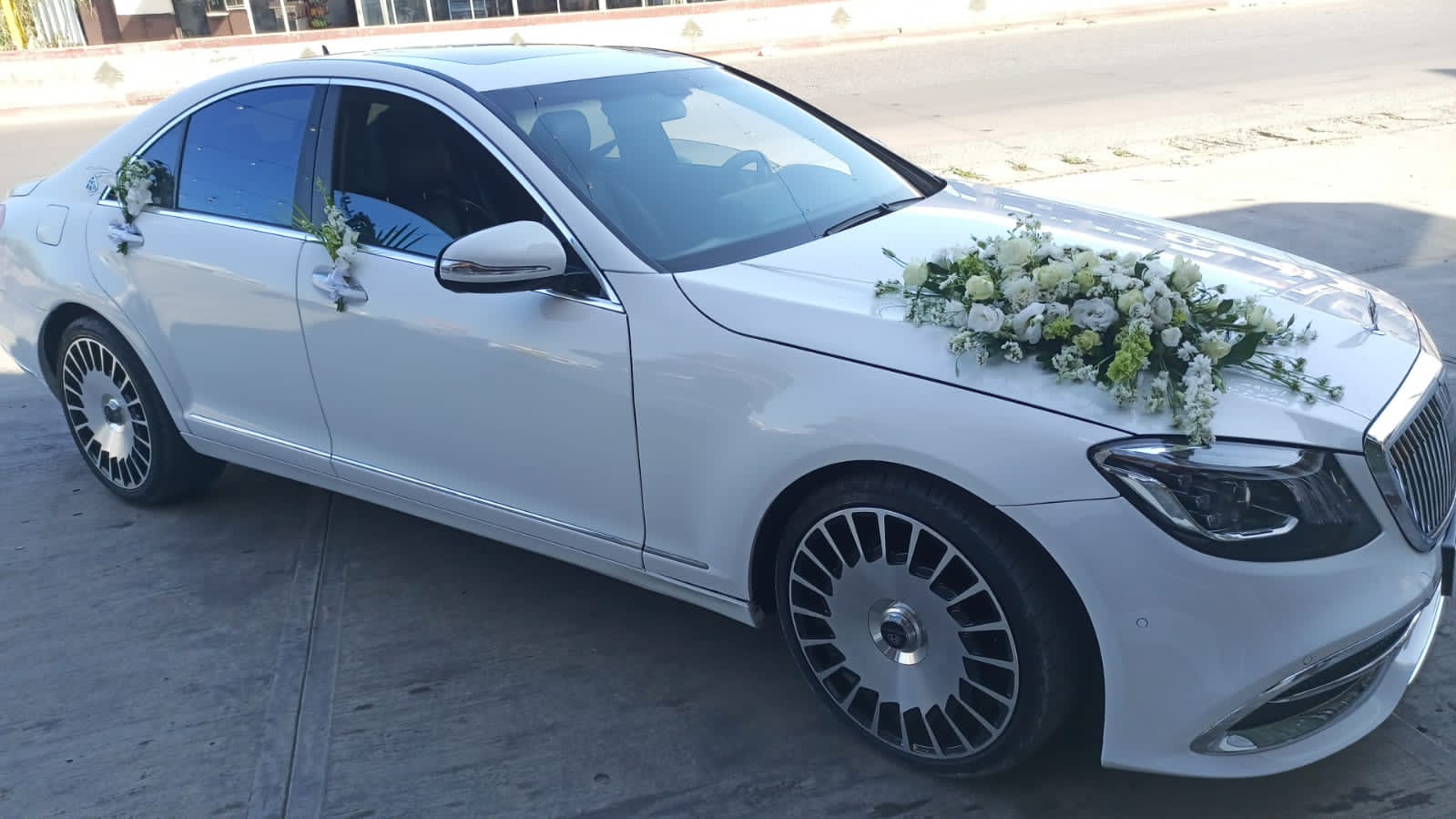Beautiful Maybach white decorated with white roses for wedding in Beirut Lebanon