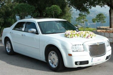 White Chrysler 300 C decorated for weddings with a Lebanese plate number