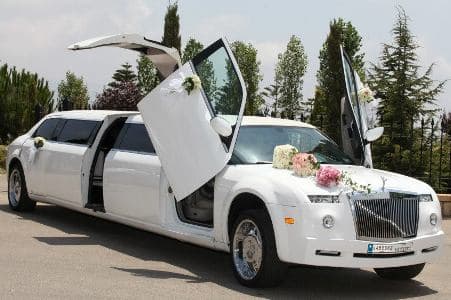 Luxury Phantom limousine with jet doors open and flower decoration